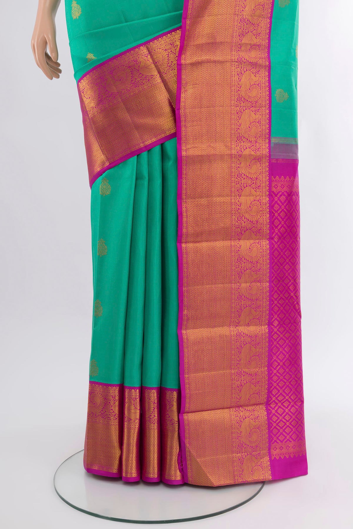 Pleats and pallu of Turquoise Kanjivaram Silk Saree with Zari Butta on the body and Zari Border. 
