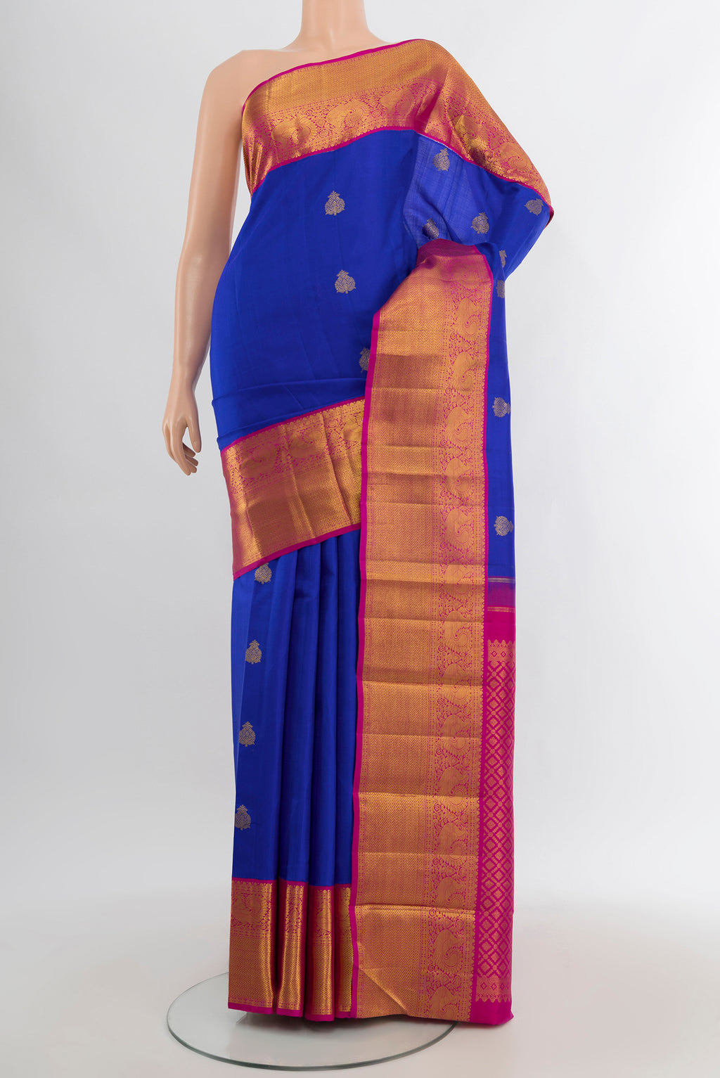 Royal Blue Kanjivaram Silk Saree with Zari Butta on the body and Zari Border.  displayed on a mannequin