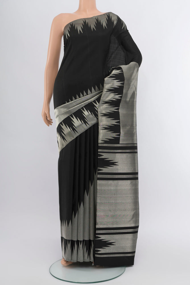Pure Silk Pure Zari Silver Kanchipuram Saree with Zari Butta on the body and Silk Border.  displayed on a mannequin