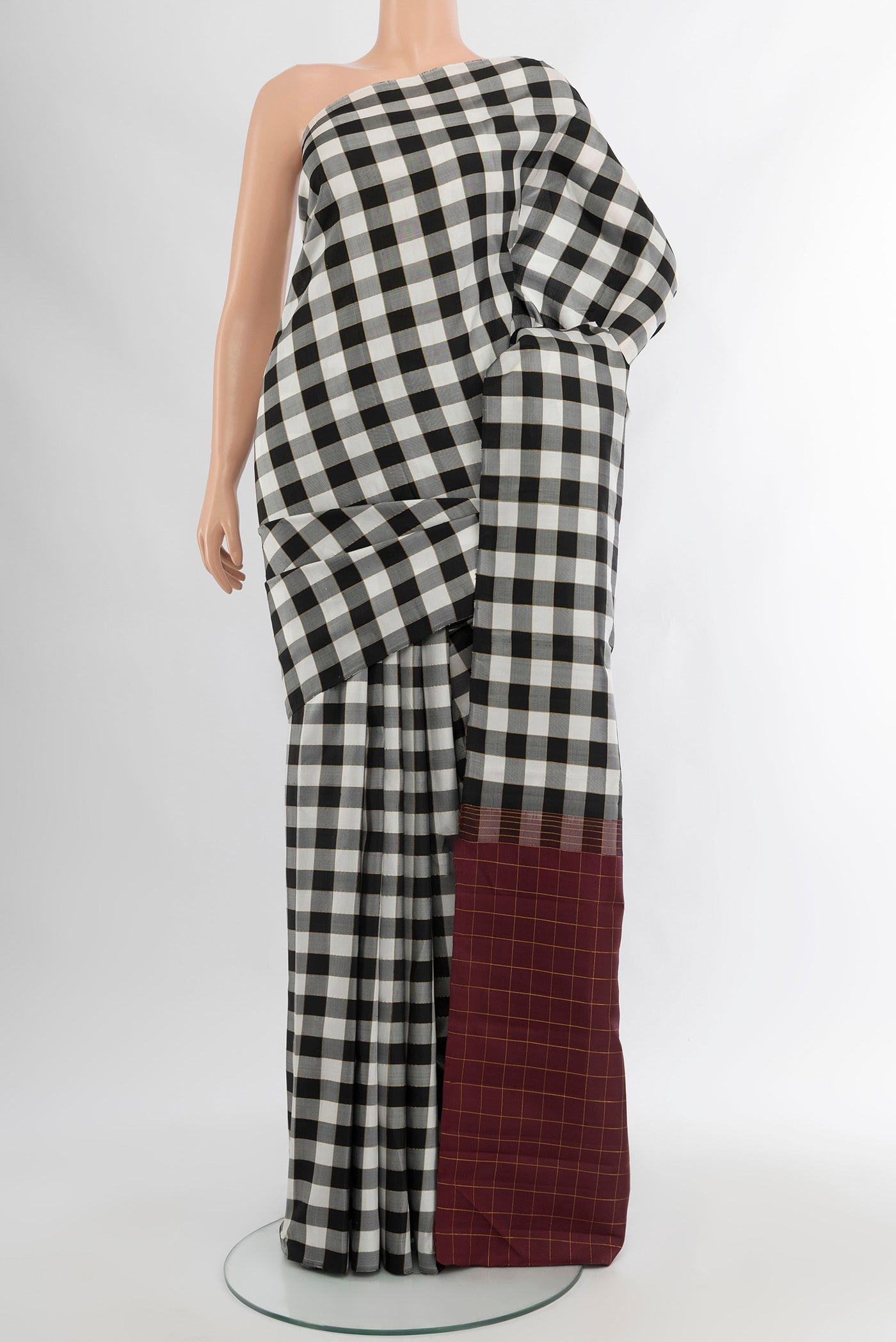 Multi Color Kanchipuram Silk Saree with Checked design on the body and Without Border.  displayed on a mannequin