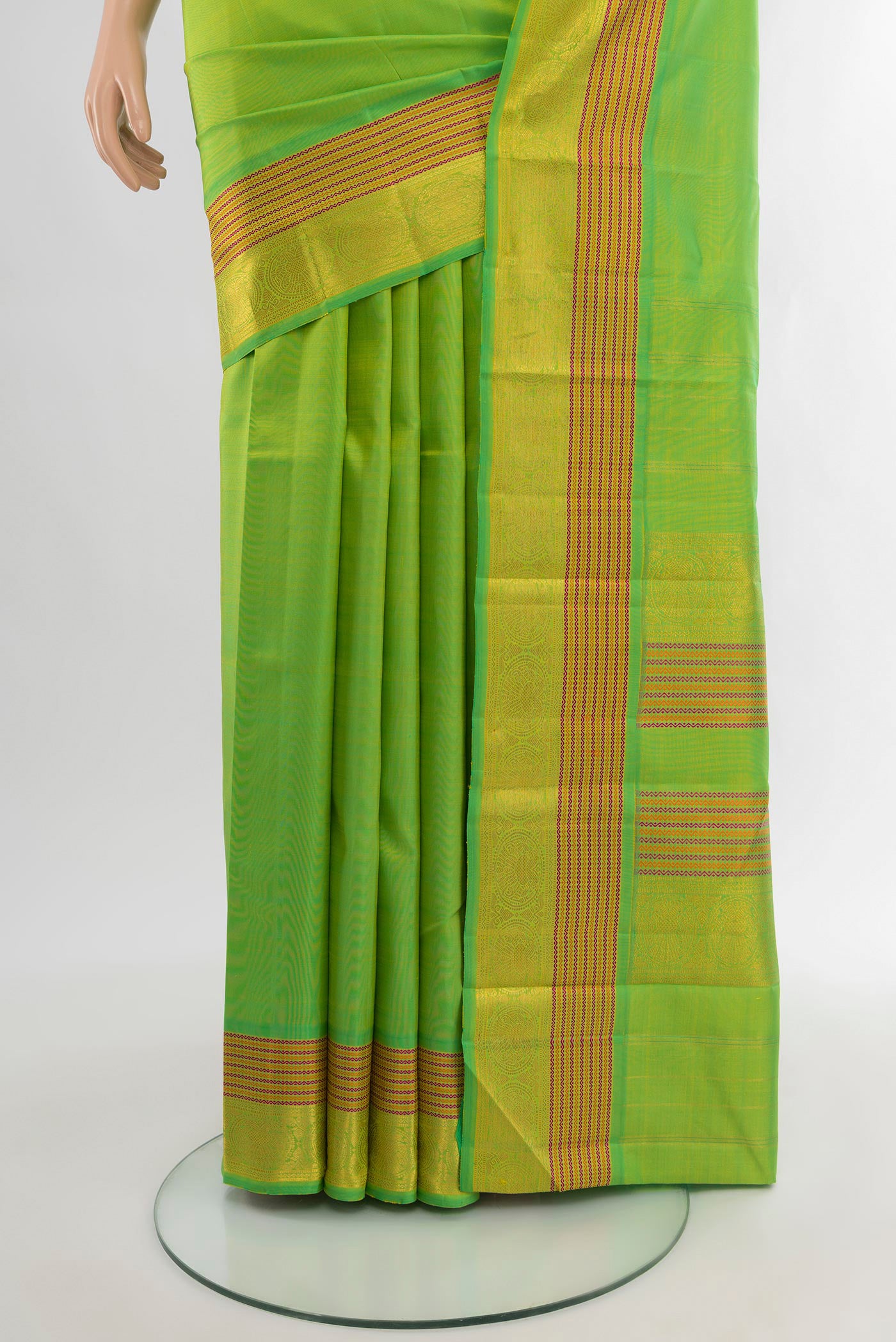 Pleats and pallu of Parrot Green Kanchipuram Silk Saree with Zari Butta on the body and Zari Border. 