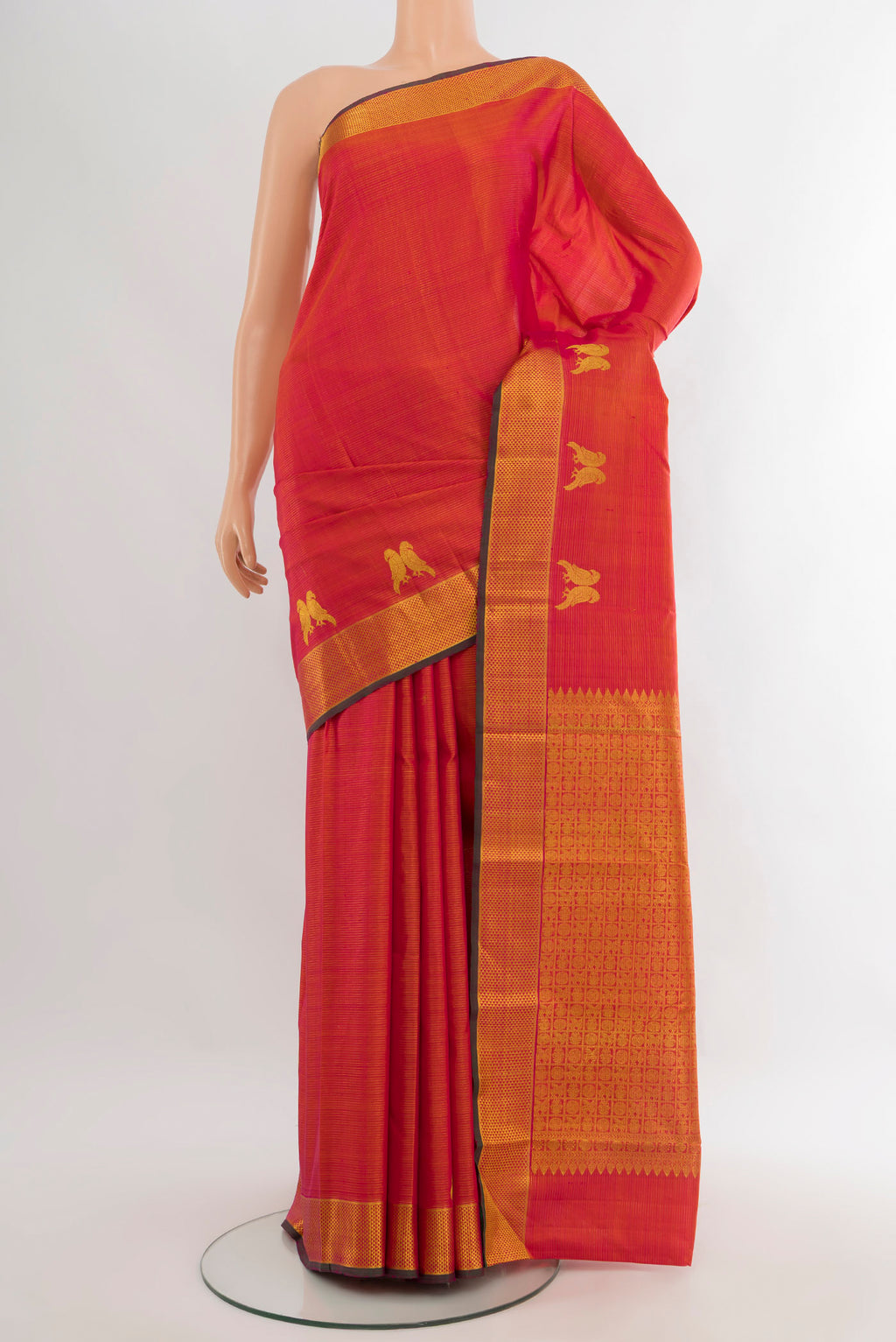 Pink with Orange Color Kanjivaram Silk Saree with Stripes on the body and Zari Border.  displayed on a mannequin