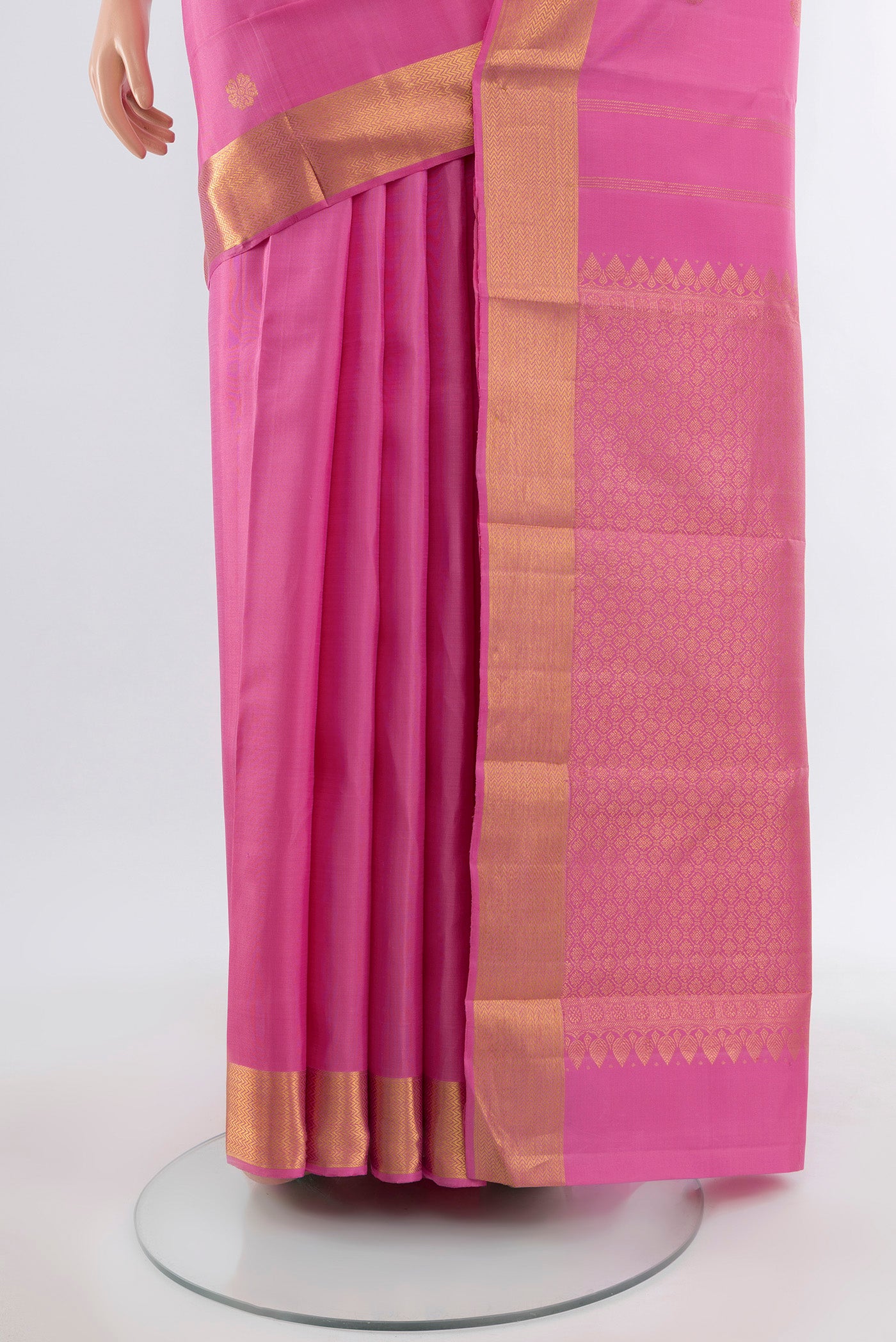 Pleats and pallu of Rose Gold Kanjivaram Silk Saree with Zari Butta on the body and Silk Border. 