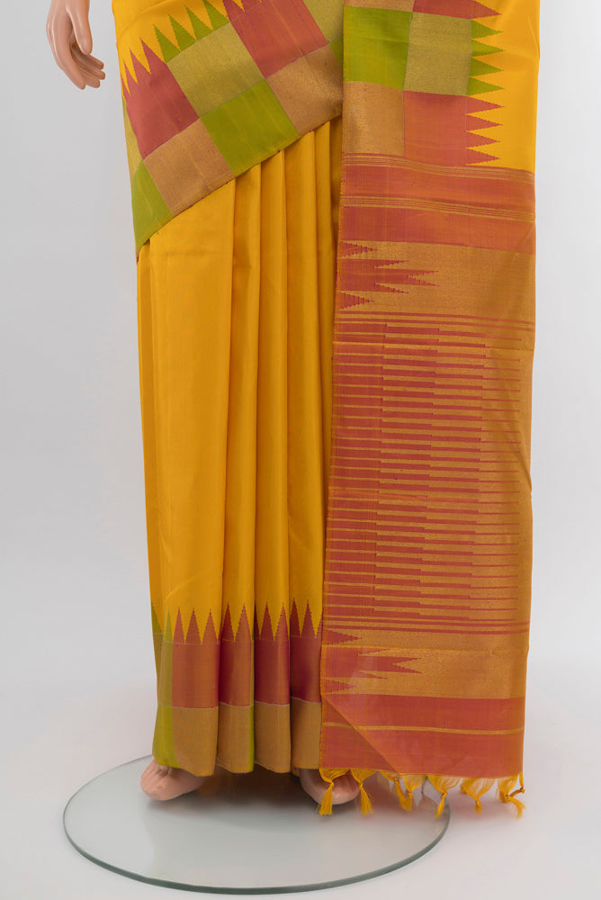 Pleats and pallu of Pure Silk Pure Zari Yellow Kanjivaram Saree with Zari Butta on the body and Silk Border. 