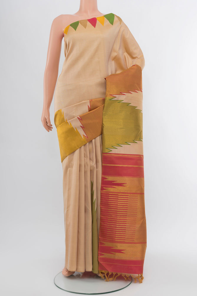 Cream Kanjivaram Silk Saree with Zari Butta on the body and Silk Border.  displayed on a mannequin