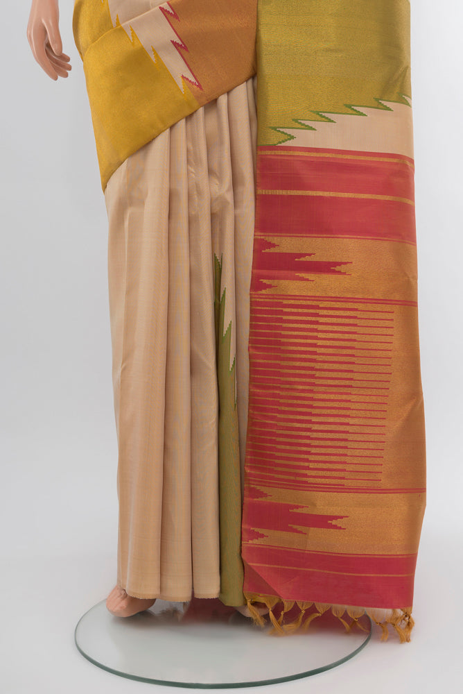 Pleats and pallu of Cream Kanjivaram Silk Saree with Zari Butta on the body and Silk Border. 