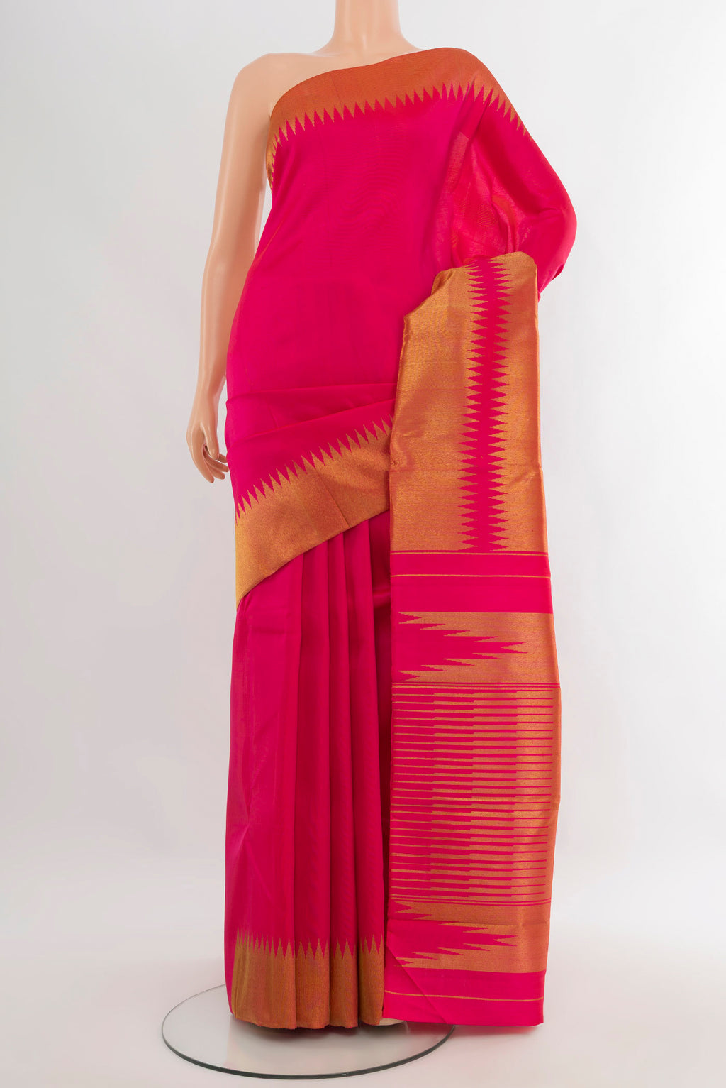Pure Silk Pure Zari Rani Pink Kanjivaram Saree with Plain Body and Temple Border.  displayed on a mannequin