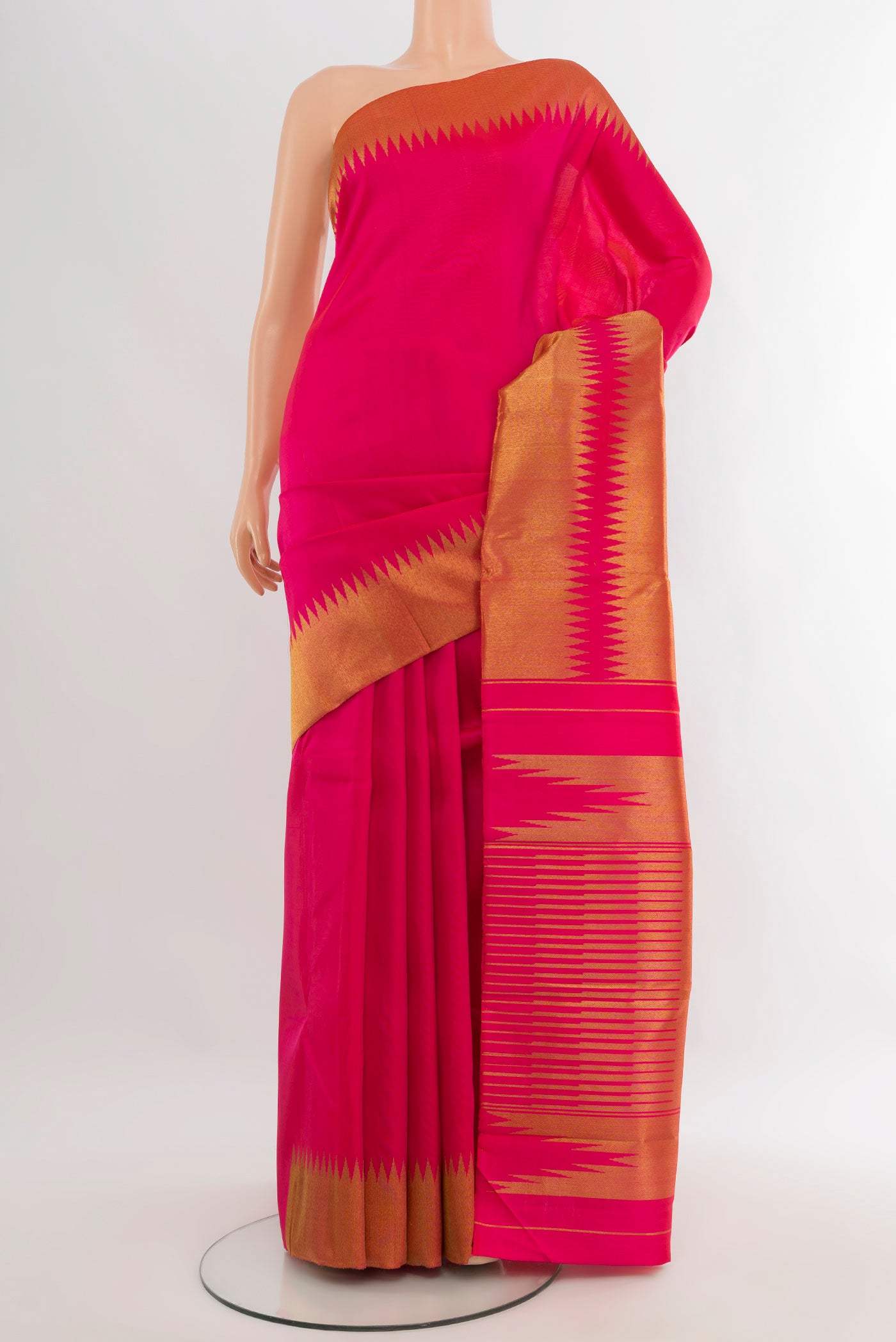 Pure Silk Pure Zari Rani Pink Kanjivaram Saree with Plain Body and Temple Border.  displayed on a mannequin