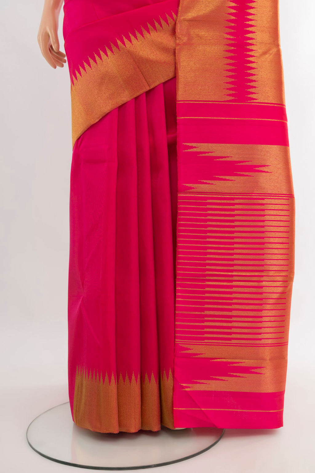 Pleats and pallu of Pure Silk Pure Zari Rani Pink Kanjivaram Saree with Plain Body and Temple Border. 