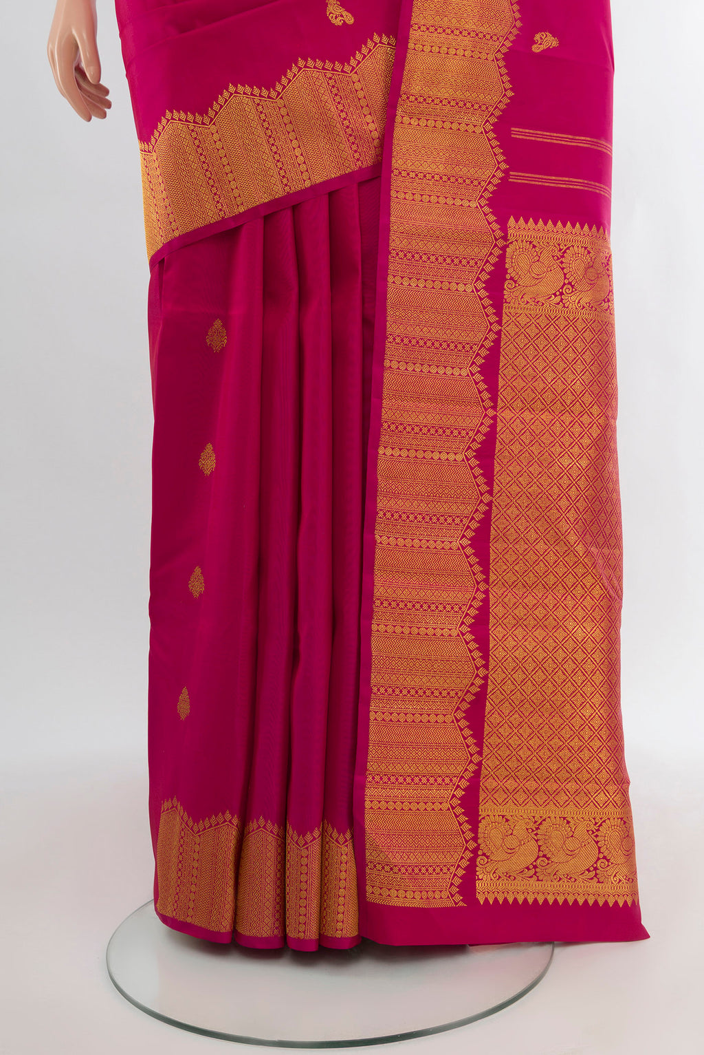 Pleats and pallu of Pure Silk Pure Zari Dark Pink Kanjivaram Saree with Zari Butta on the body and Silk Border. 