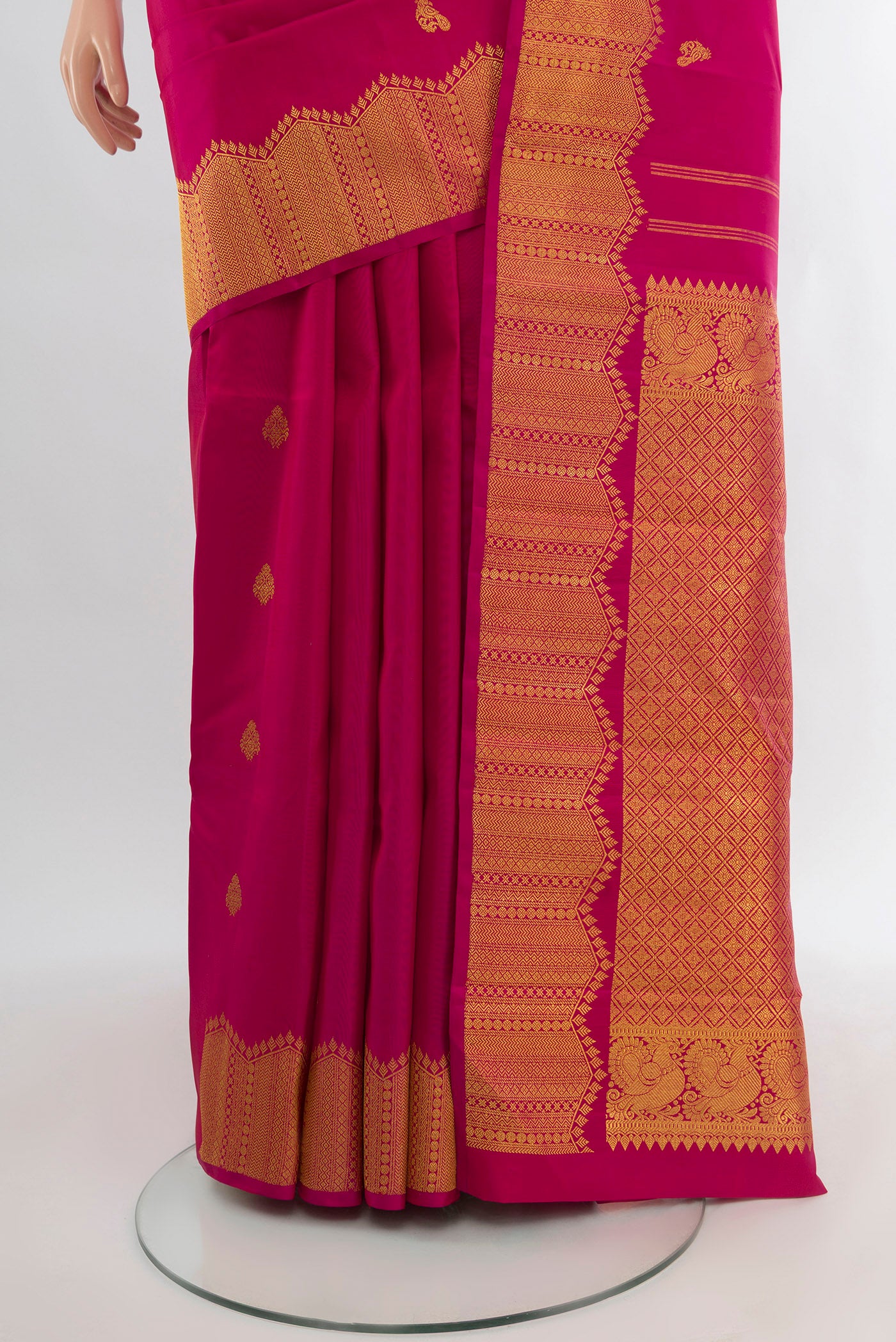 Pleats and pallu of Pure Silk Pure Zari Dark Pink Kanjivaram Saree with Zari Butta on the body and Silk Border. 