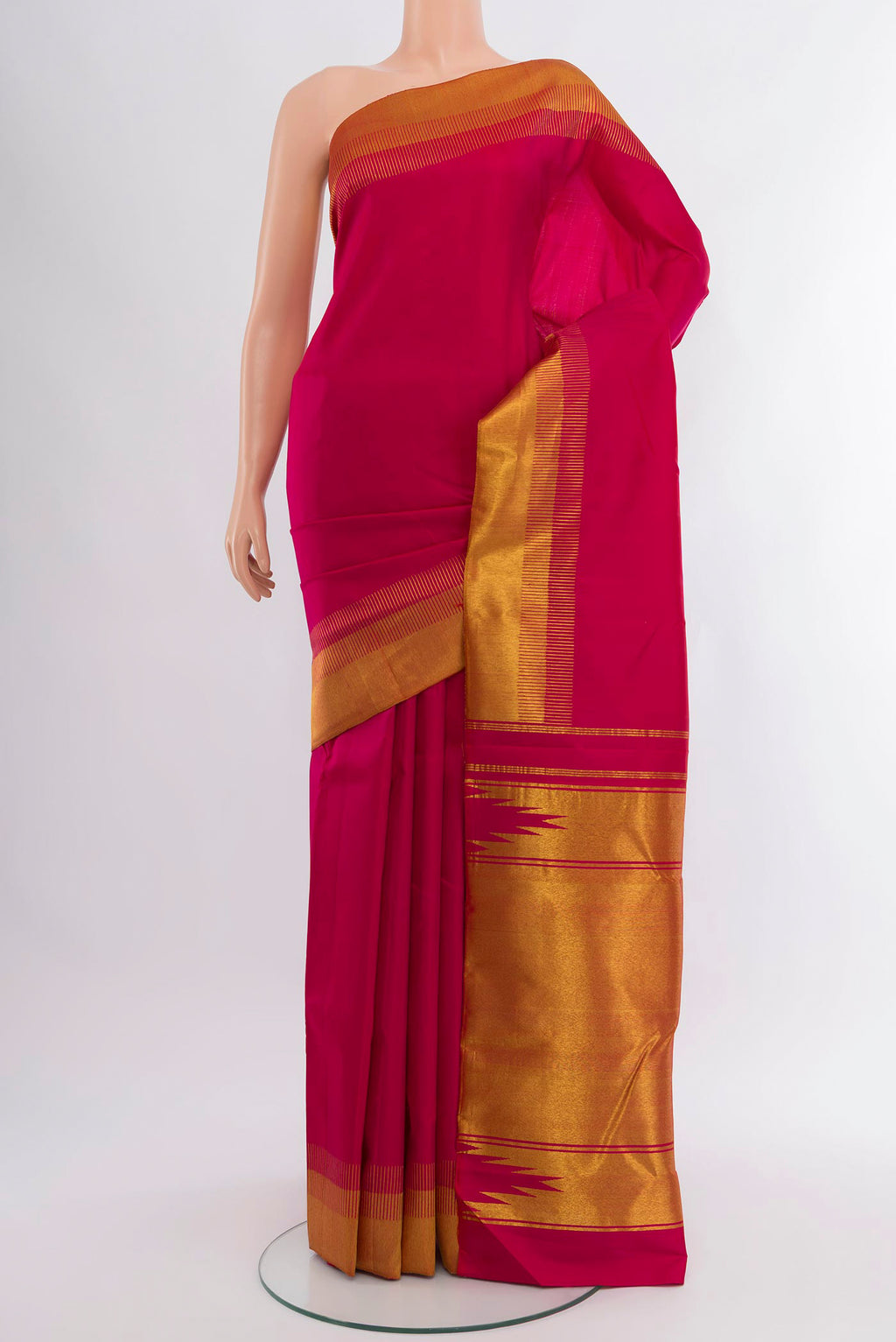 Pink Kanjivaram Silk Saree with Plain Body and Zari Border.  displayed on a mannequin
