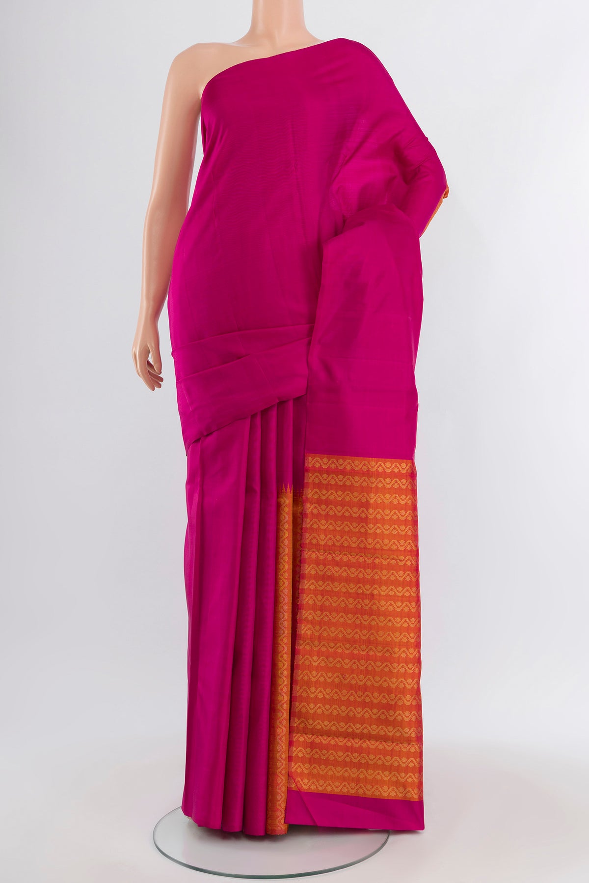 Magenta Kanchipuram Silk Saree with Plain Body and Without Border.  displayed on a mannequin