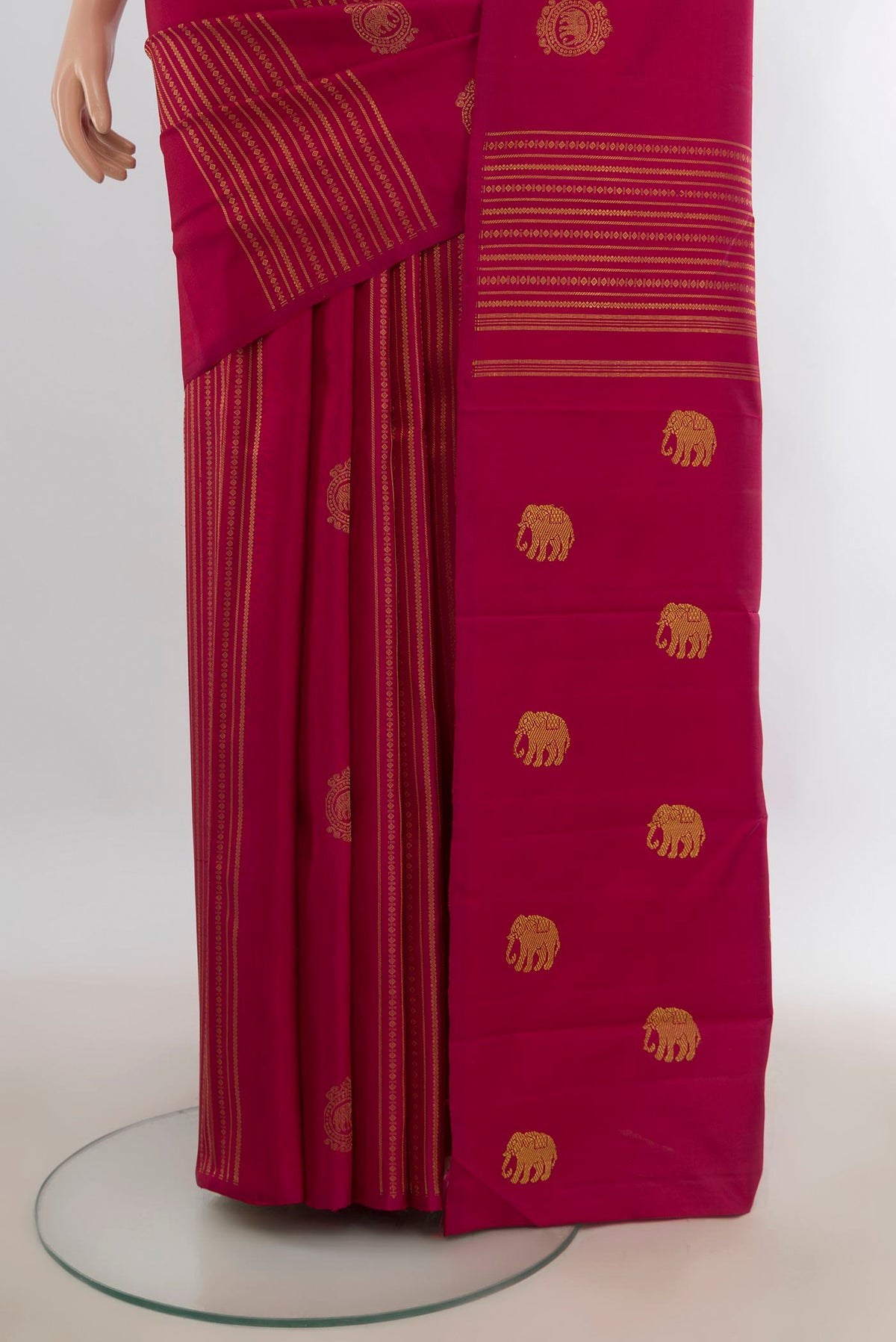Pleats and pallu of Pure Silk Pure Zari Deep Red Kanchipuram Saree with Zari Butta on the body and Without Border. 