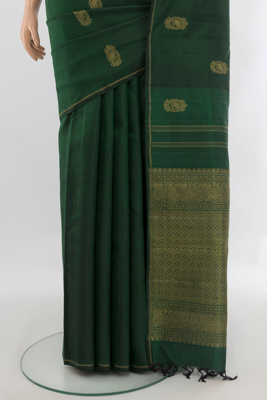 Pleats and pallu of Pure Silk Pure Zari Bottle Green Kanchipuram Saree with Zari Butta on the body and Thin Zari Line. 