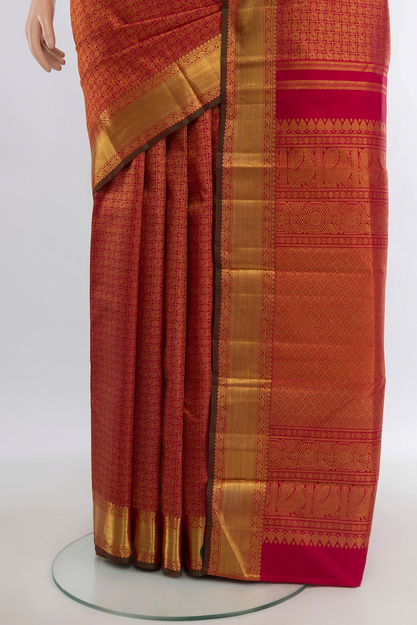 Pleats and pallu of Pure Silk Pure Zari Maroon Kanjivaram Saree with Zari Brocade on the body and Zari Border. 
