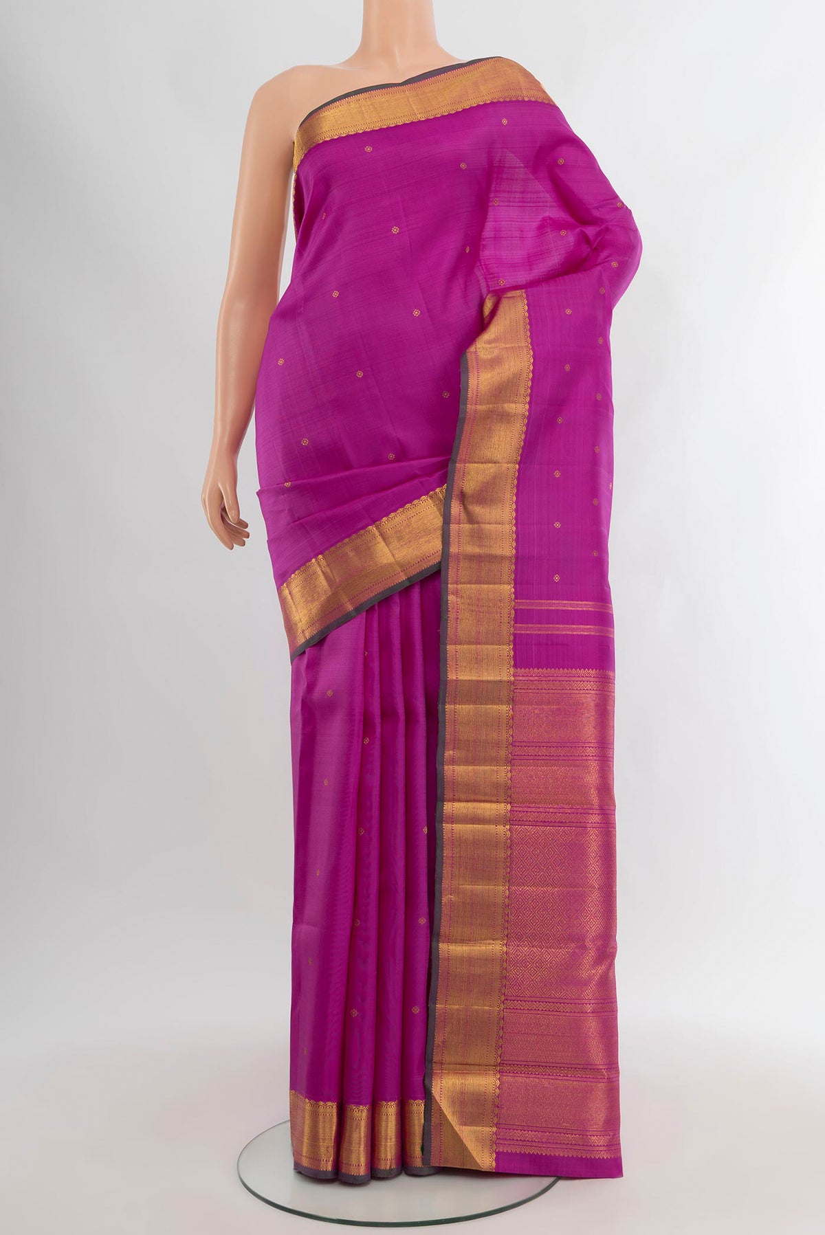 Pure Silk Pure Zari Magenta Kanjivaram Saree with Zari Butta on the body and Zari Border.  displayed on a mannequin