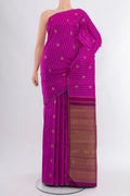 Pure Silk Pure Zari Magenta Kanjivaram Saree with Zari Butta on the body and Thin Zari Line.  displayed on a mannequin