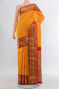 Pure Silk Pure Zari Yellow Kanjivaram Saree with Zari Butta on the body and Zari Border.  displayed on a mannequin