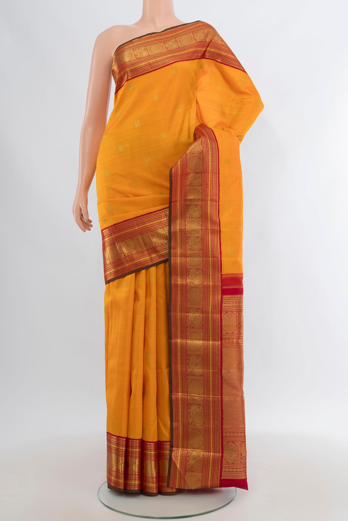 Pure Silk Pure Zari Yellow Kanjivaram Saree with Zari Butta on the body and Zari Border.  displayed on a mannequin