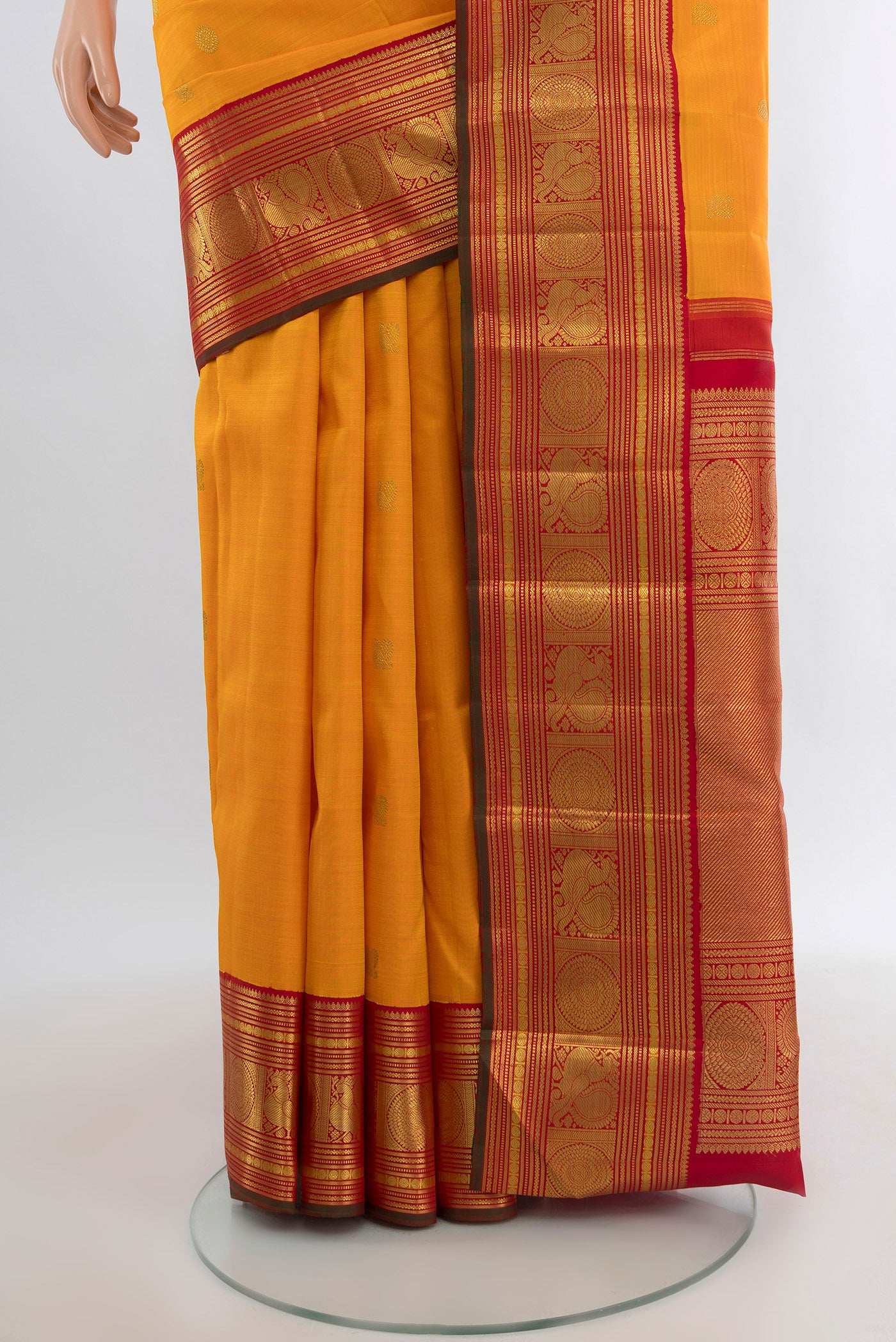 Pleats and pallu of Pure Silk Pure Zari Yellow Kanjivaram Saree with Zari Butta on the body and Zari Border. 