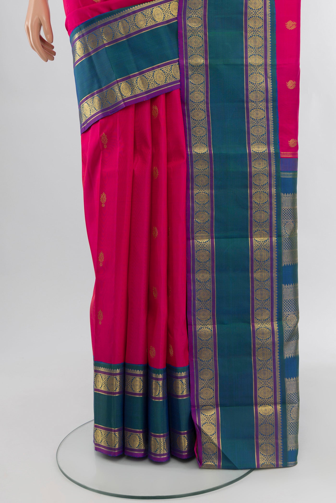 Pleats and pallu of Pure Silk Pure Zari Dark Pink Kanjivaram Saree with Zari Butta on the body and Zari Border. 
