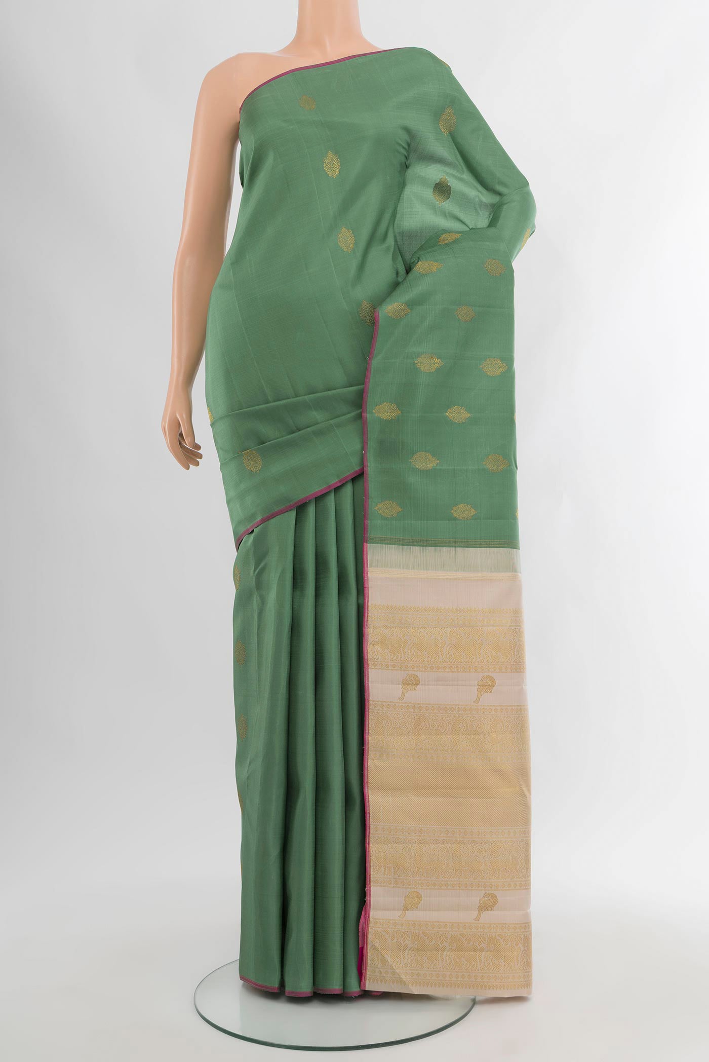 Pure Silk Pure Zari Olive Green Kanchipuram Saree with Zari Butta on the body and Without Border.  displayed on a mannequin