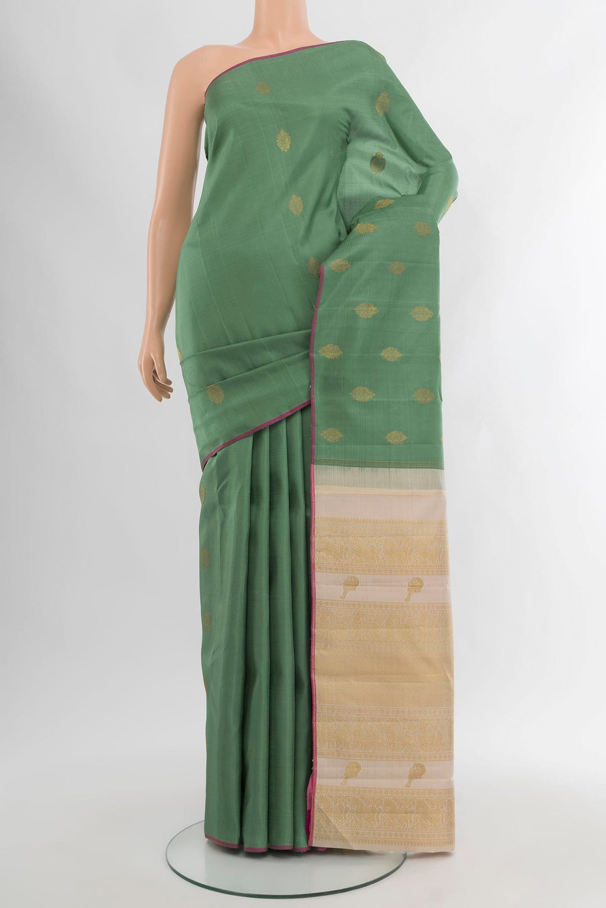 Pure Silk Pure Zari Olive Green Kanchipuram Saree with Zari Butta on the body and Without Border.  displayed on a mannequin