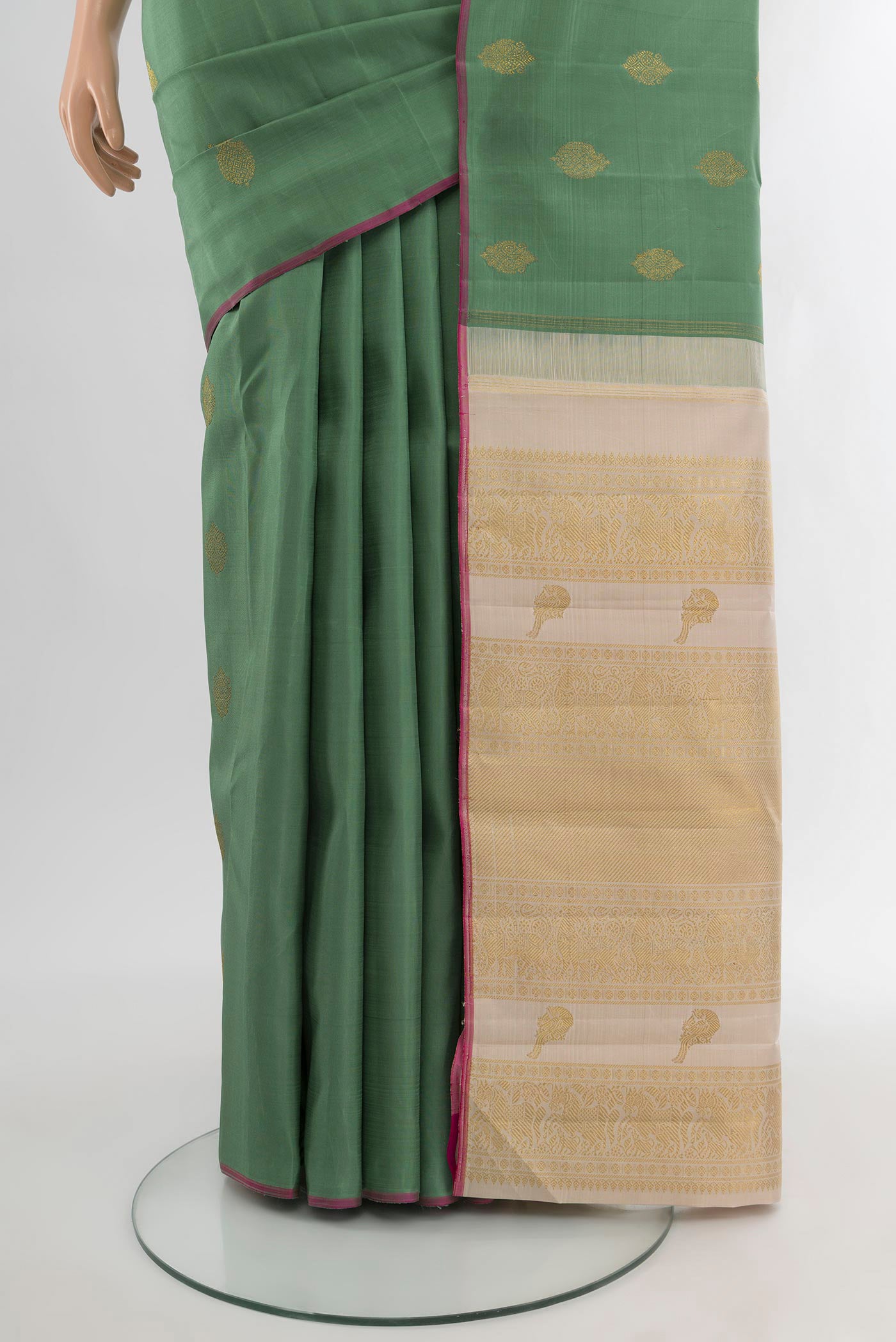 Pleats and pallu of Pure Silk Pure Zari Olive Green Kanchipuram Saree with Zari Butta on the body and Without Border. 