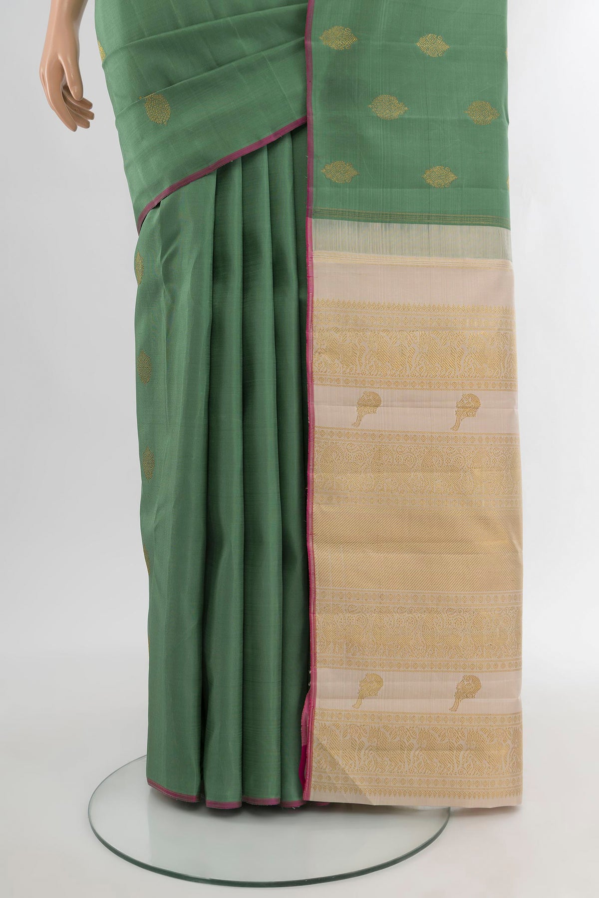 Pleats and pallu of Pure Silk Pure Zari Olive Green Kanchipuram Saree with Zari Butta on the body and Without Border. 