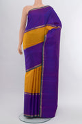 Pure Silk Pure Zari Mustard Kanchipuram Saree with Zari Butta on the body and Silk Border.  displayed on a mannequin