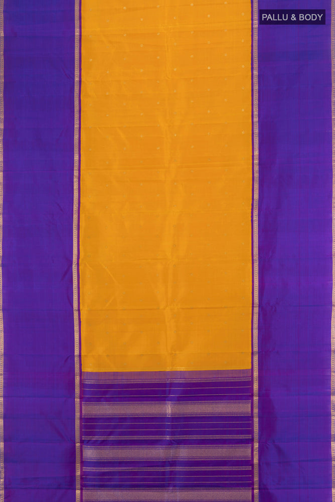 Flat view of Pure Silk Pure Zari Mustard Kanchipuram Saree with Zari Butta on the body and Silk Border. 