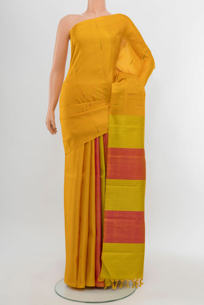 Pure Silk Pure Zari Mustard Kanjivaram Saree with Zari Butta on the body and Silk Border.  displayed on a mannequin