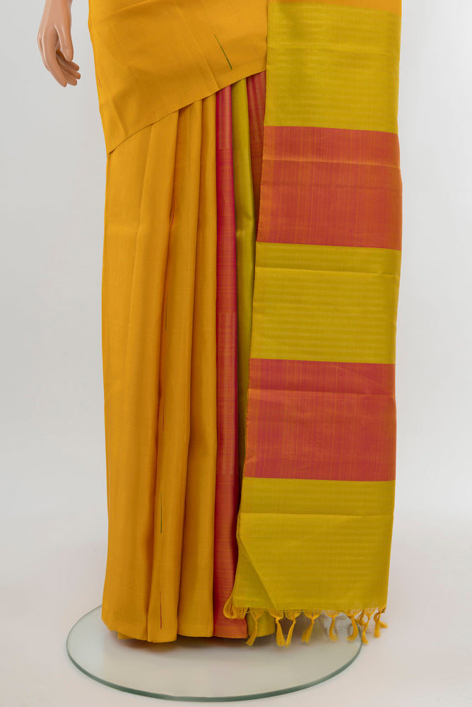Pleats and pallu of Pure Silk Pure Zari Mustard Kanjivaram Saree with Zari Butta on the body and Silk Border. 