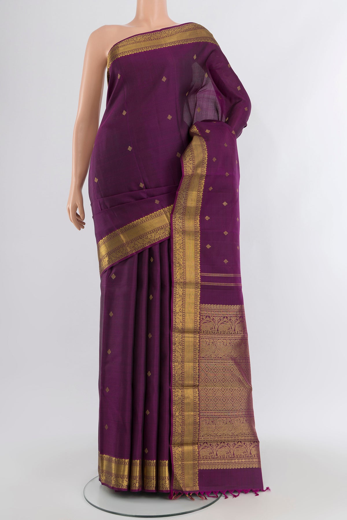 Pure Silk Pure Zari Violet Kanjivaram Saree with Zari Butta on the body and Zari Border.  displayed on a mannequin