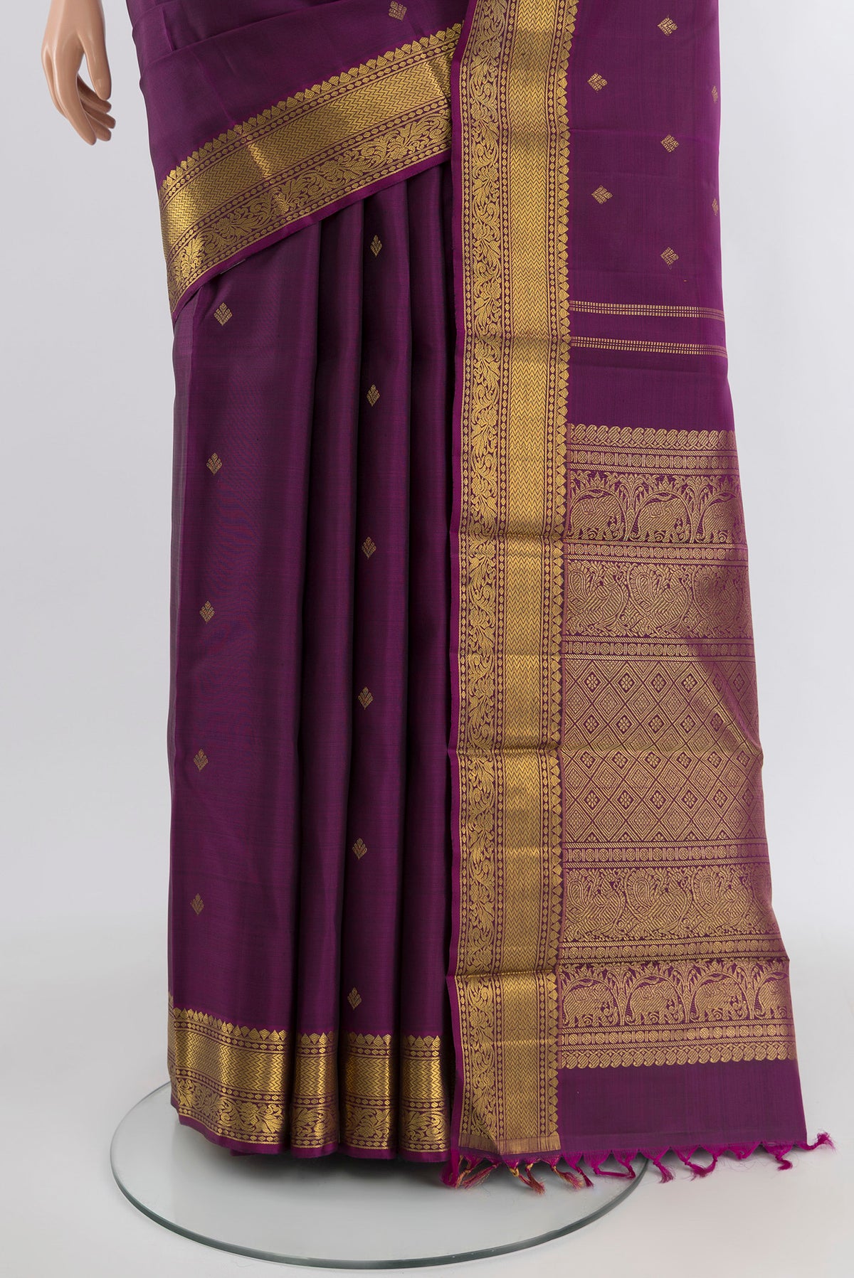 Pleats and pallu of Pure Silk Pure Zari Violet Kanjivaram Saree with Zari Butta on the body and Zari Border. 