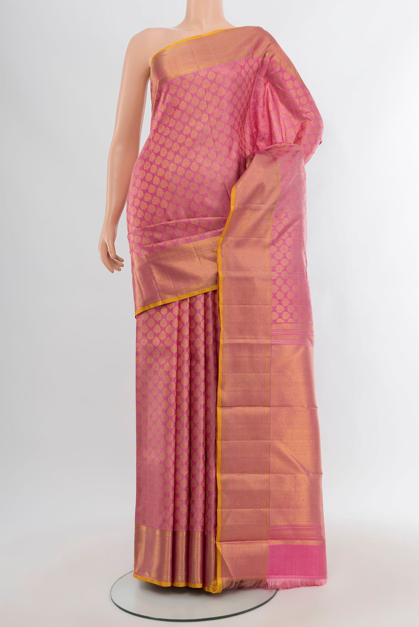 Rose pink Kanchipuram Silk Saree with Zari Brocade on the body and Zari Border.  displayed on a mannequin