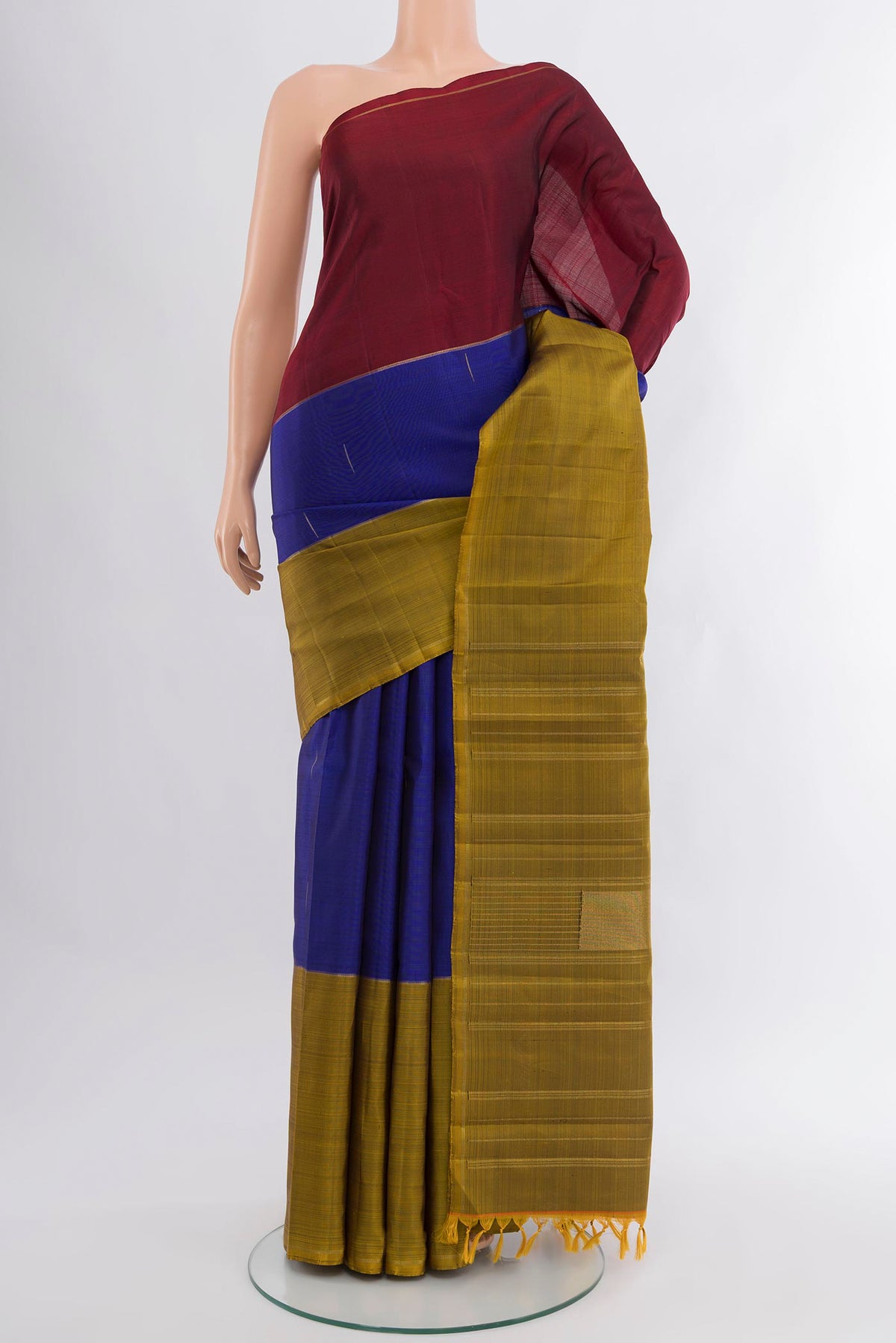 Pure Silk Pure Zari Dark Blue Kanjivaram Saree with Zari Butta on the body and Ganga Jamuna Border.  displayed on a mannequin