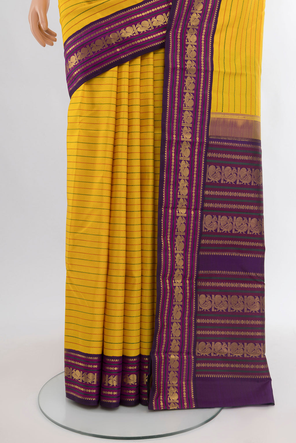 Pleats and pallu of Yellow Kanjivaram Silk Saree with Stripes on the body and Zari Border. 