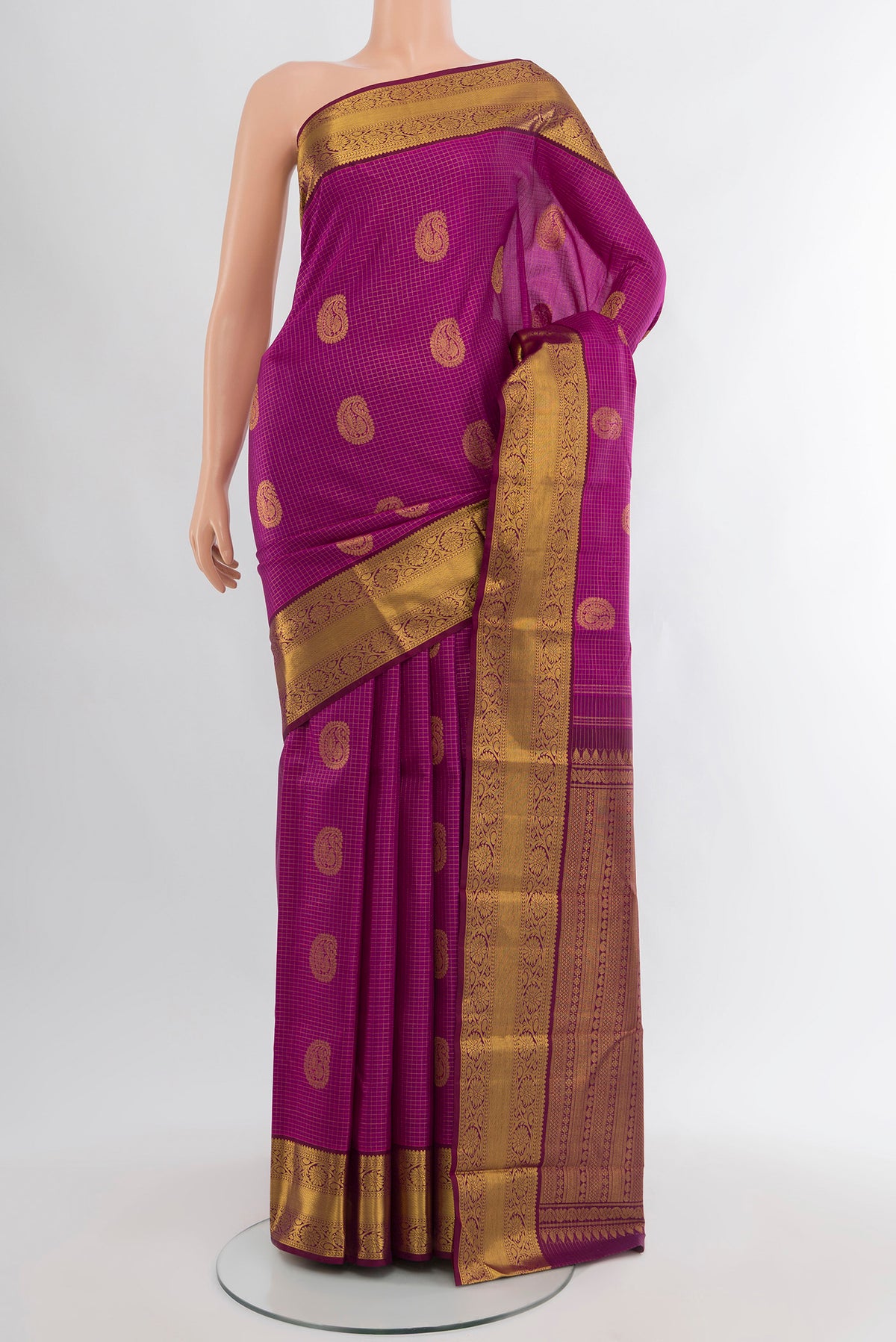 Magenta Kanjivaram Silk Saree with Zari Butta on the body and Zari Border.  displayed on a mannequin