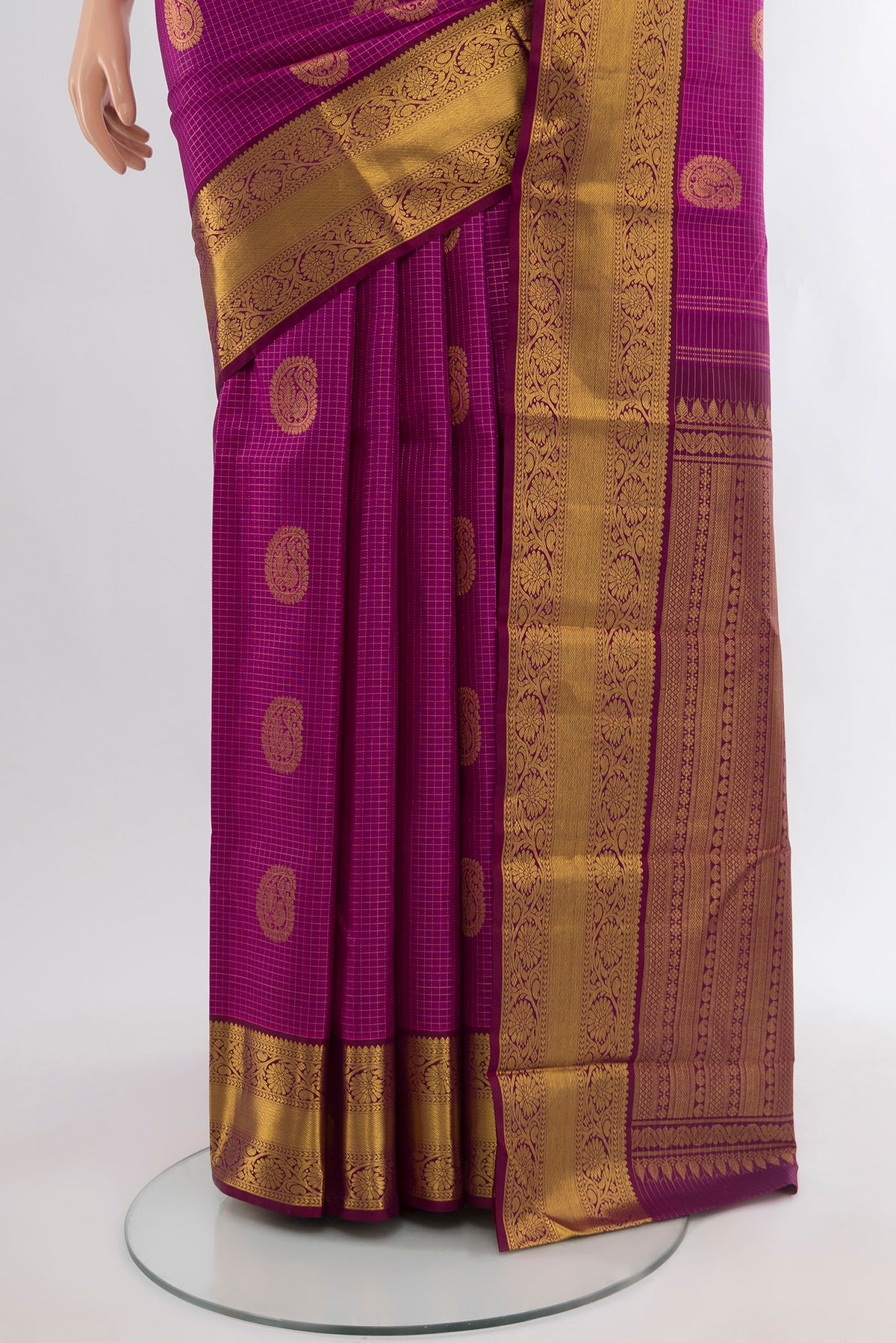 Pleats and pallu of Magenta Kanjivaram Silk Saree with Zari Butta on the body and Zari Border. 