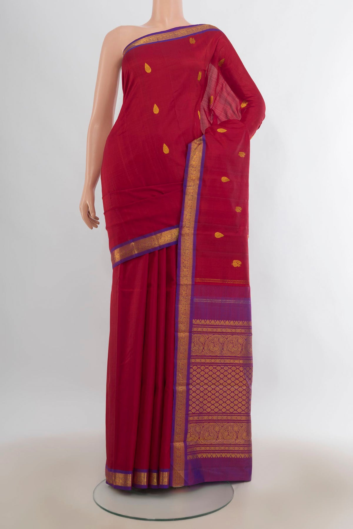 Pure Silk Red Kanchipuram Saree with Zari Butta on the body and Zari Border.  displayed on a mannequin