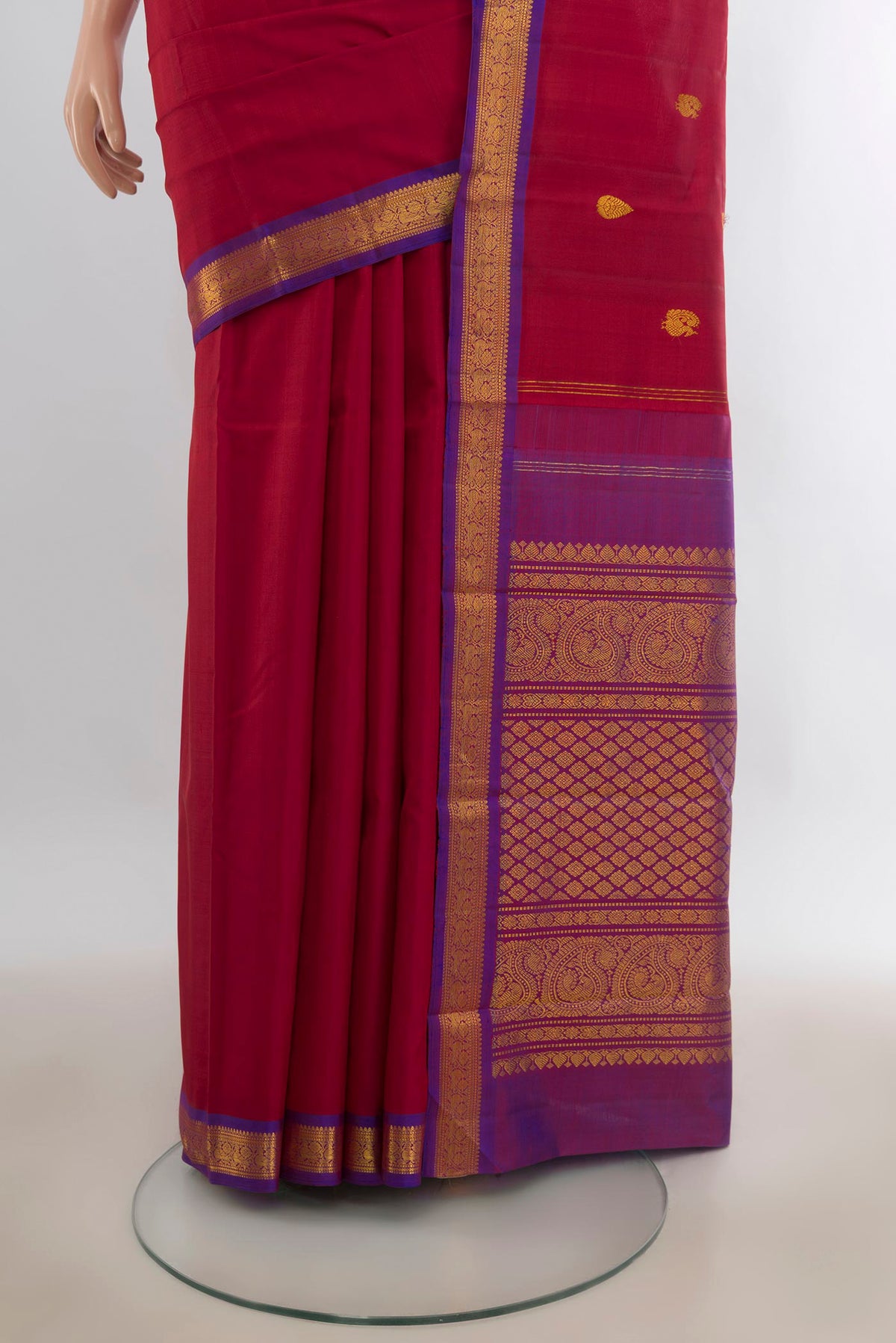Pleats and pallu of Pure Silk Red Kanchipuram Saree with Zari Butta on the body and Zari Border. 