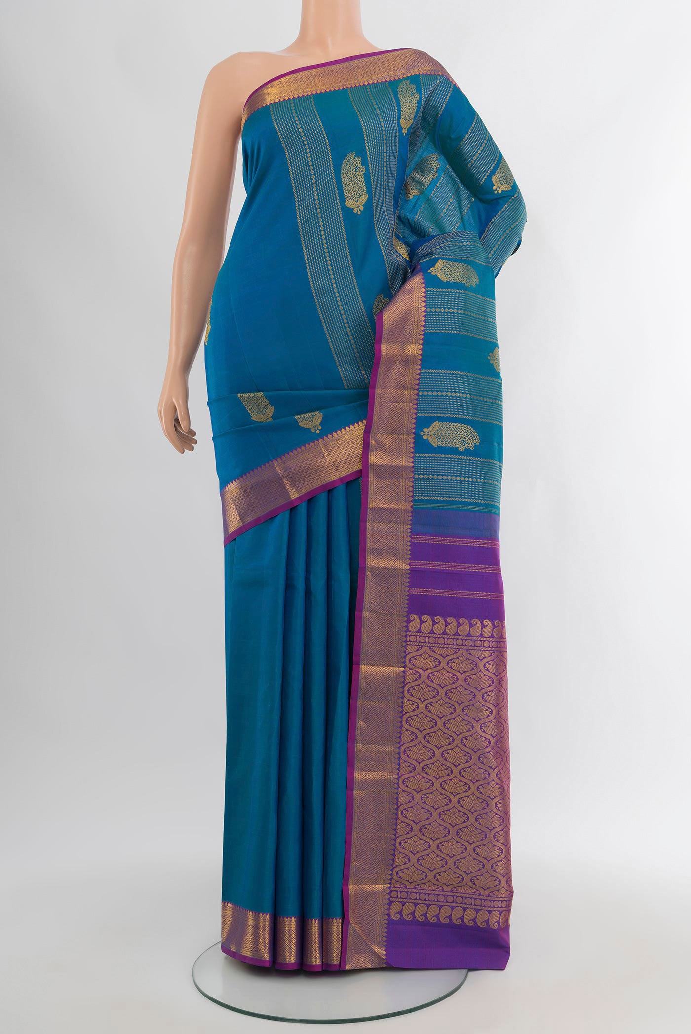 Blue Kanjivaram Silk Saree with Zari Butta on the body and Zari Border.  displayed on a mannequin