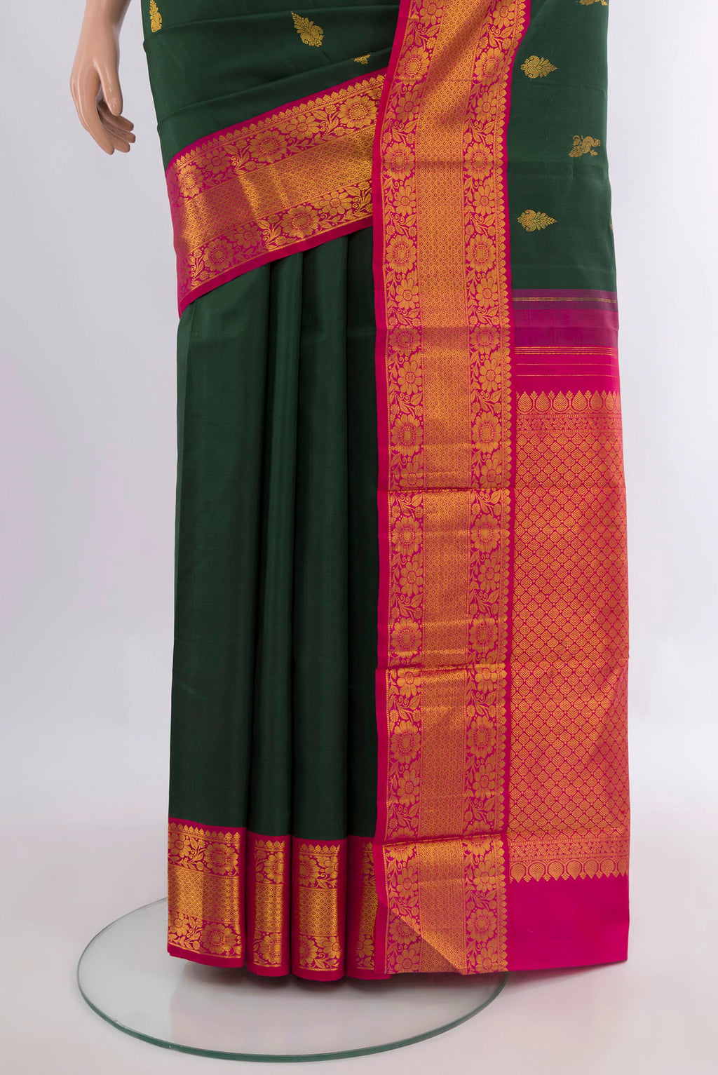 Pleats and pallu of Pure Silk Bottle Green Kanjivaram Saree with Zari Butta on the body and Zari Border. 