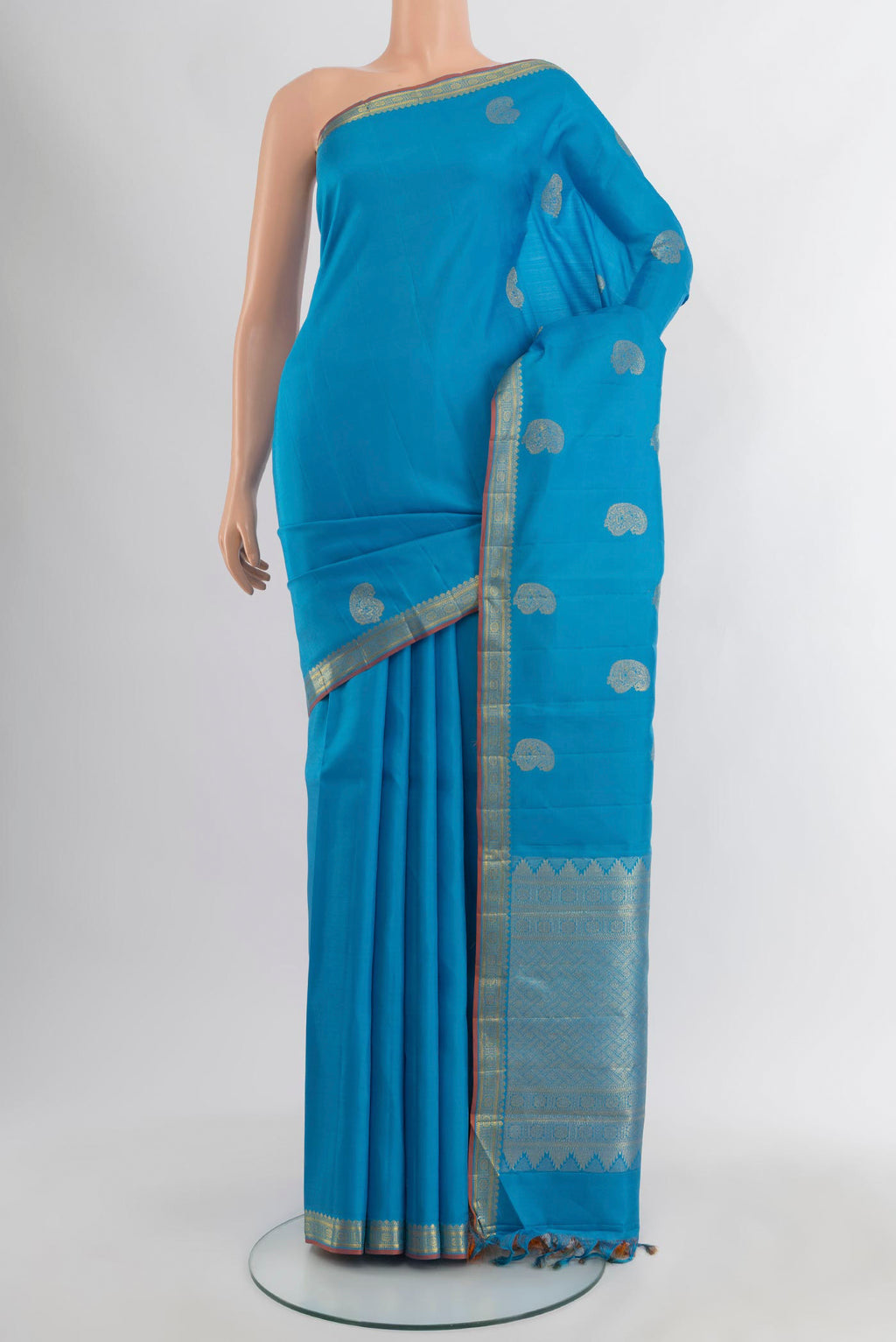Blue Kanchipuram Silk Saree with Zari Butta on the body and Zari Border.  displayed on a mannequin