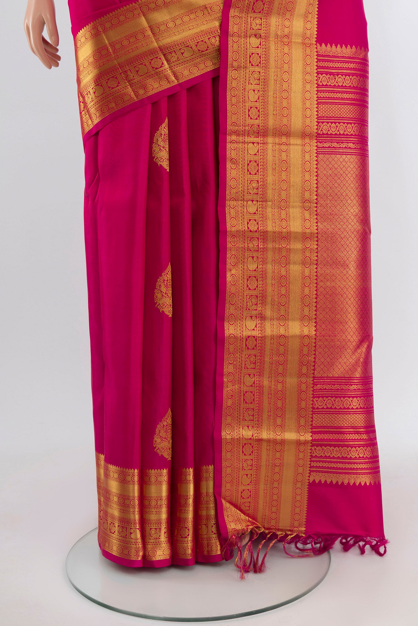 Pleats and pallu of Dark Pink Kanjivaram Silk Saree with Zari Butta on the body and Zari Border. 