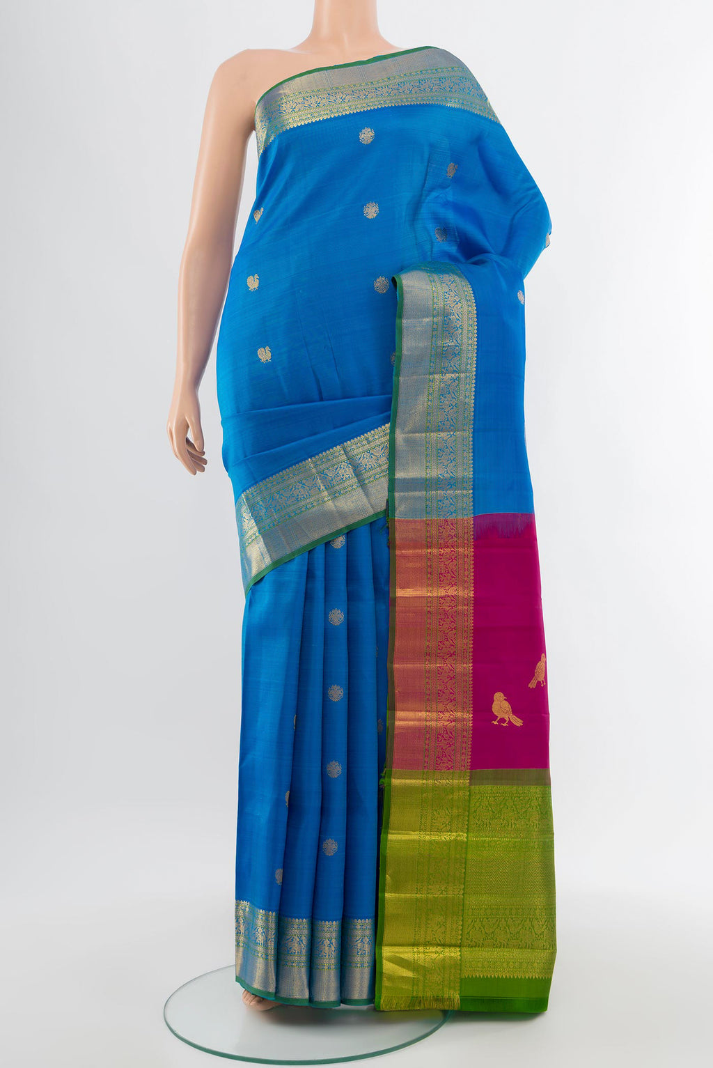 Pure Silk Pure Zari Light Blue Kanchipuram Saree with Zari Butta on the body and Silk Border.  displayed on a mannequin