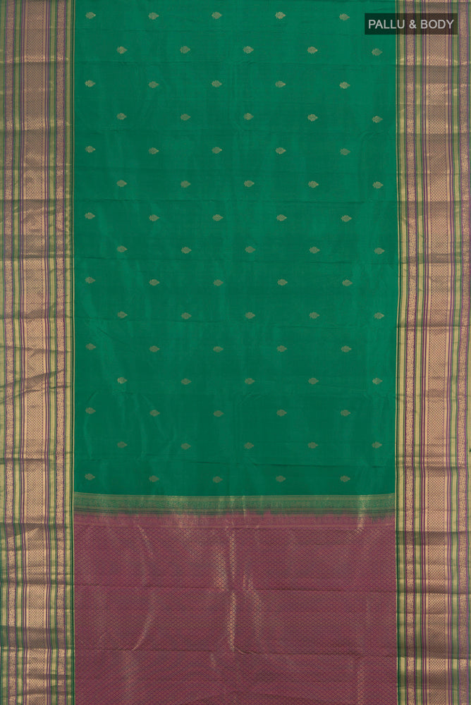 Flat view of Peacock Blue Kanchipuram Silk Saree with Zari Butta on the body and Silk Border. 