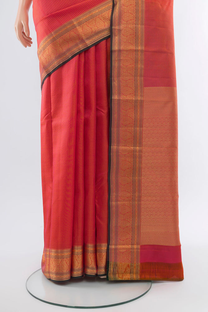 Pleats and pallu of Golden Peach Kanchipuram Silk Saree with Zari Butta on the body and Silk Border. 
